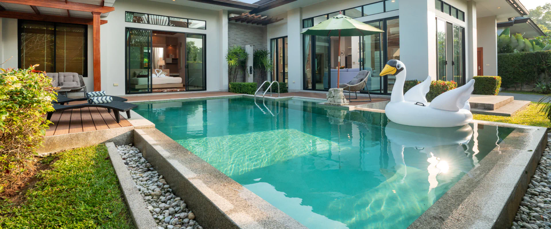 swimming pool in a tropical garden pool villa with floating swan balloon